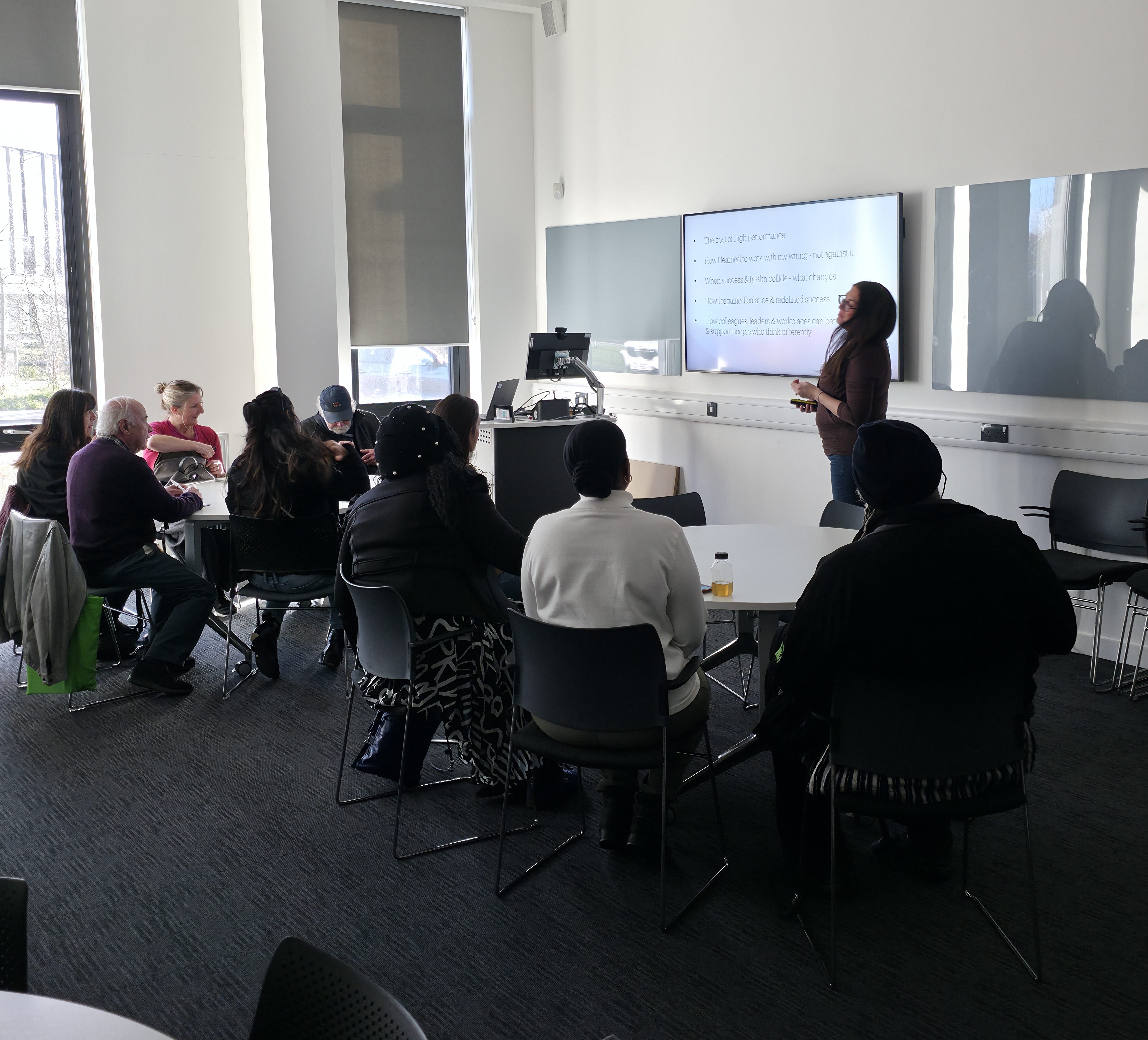 Jodie Steele speaking at a conference